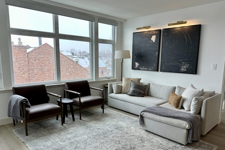Cherry Creek living room with snowfall city views